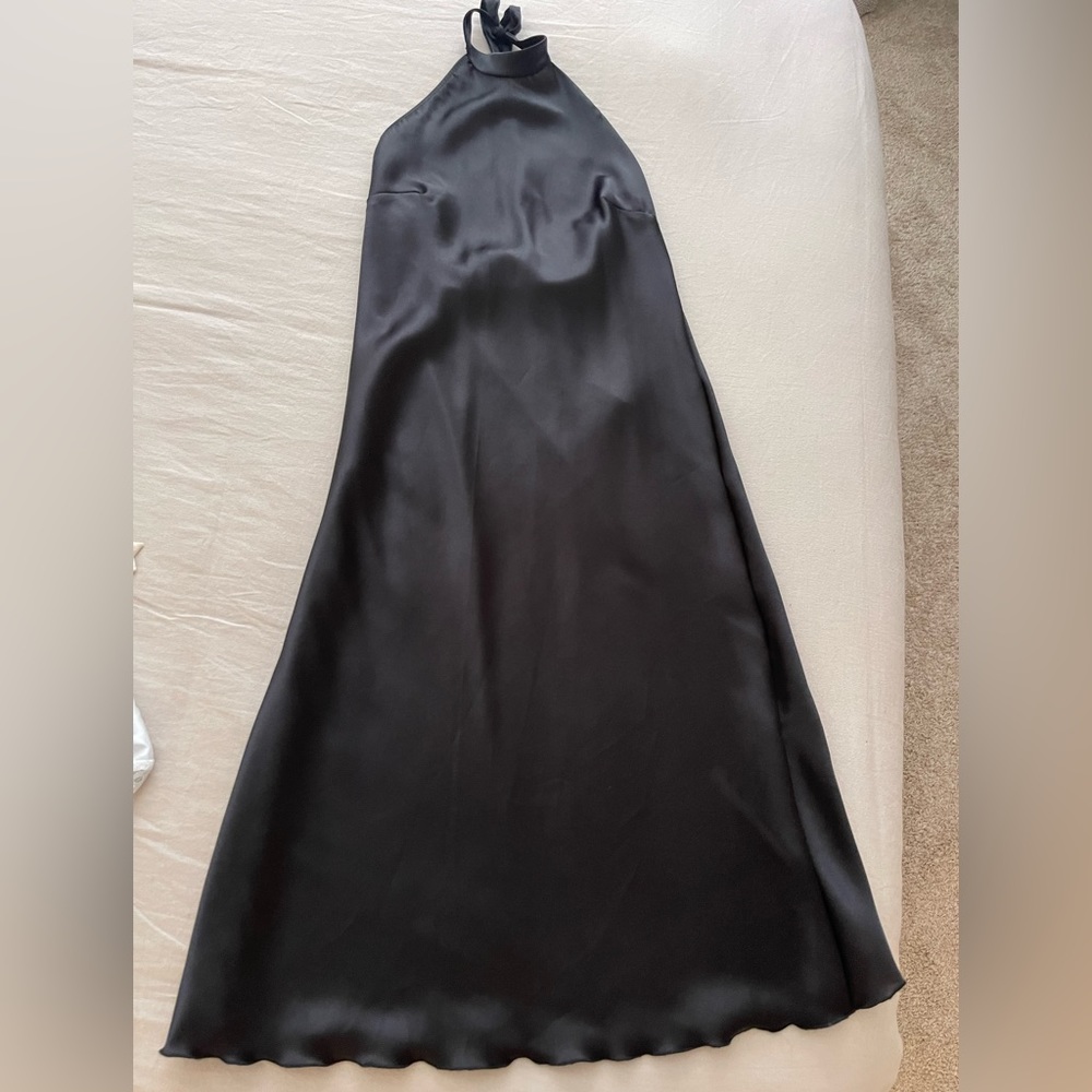 Small black Bebe midi slip dress with open back. It ties around the neck.